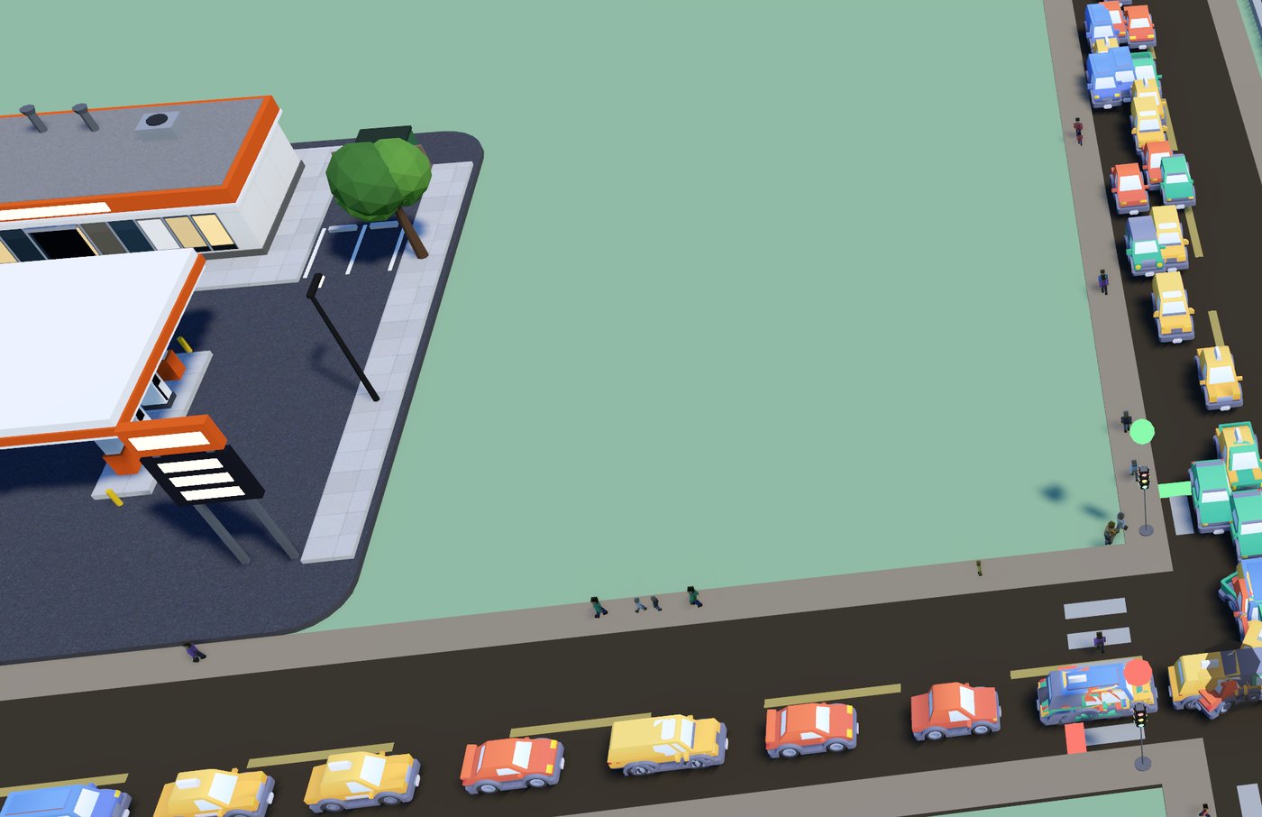 Traffic queuing at a junction beside a gas station